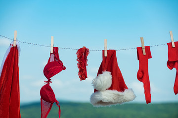 christmas clothes hanging on rope with pin