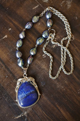 Beautiful romantic necklace on the wooden table
