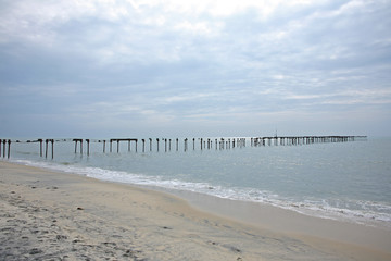 Abandoned pier on an overcast day on Alleppey Beach, Kerala, India