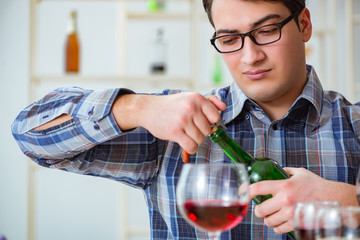Professional sommelier tasting red wine 
