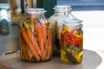 Glass jars with pickled vegetables 