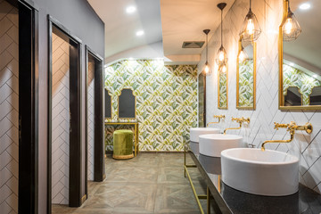 Washbasins and mirrors in public toilet in luxury hotel