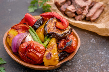 Grilled vegetables salad with eggplant, onions, peppers, asparagus, tomato