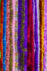 The colorful multi color of tinsel for a background.