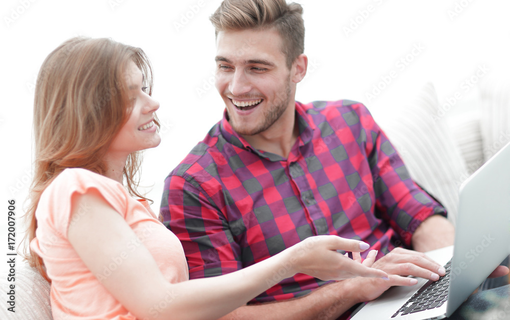 Poster closeup of young couple with laptop