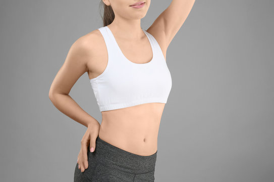 Young woman on gray background. Diet concept