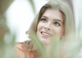 Fototapeta premium portrait of smiling woman face on blurred background.