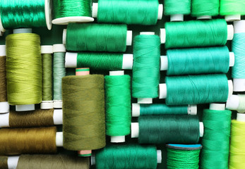 Green composition with threads, close up
