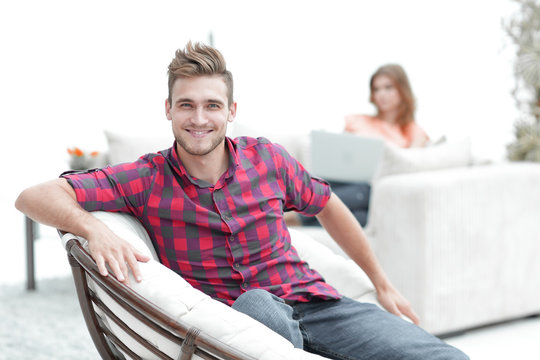 Young Man Sitting In The Big Chair