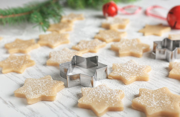Christmas composition with raw cookies on wooden table