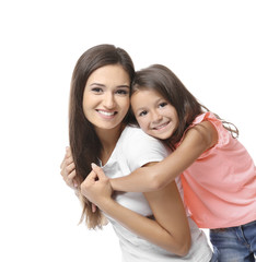 Cute little girl with mother on white background