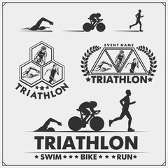 Set of triathlon labels, emblems badges and design elements. Swimming, cycling and running. - obrazy, fototapety, plakaty