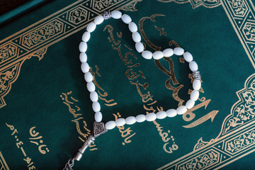 Holy Quran Book With Rosary. Prayer Concept. toned