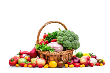 Vegetables and fruit in a basket isolated on white background.