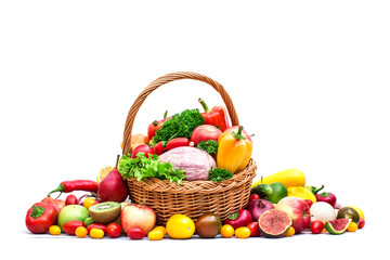 Composition with vegetables and fruits in wicker basket isolated on white.