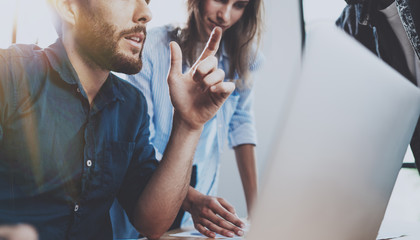 Working process at office.Group of young coworkers work together modern coworking studio.Young...