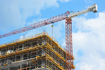 Crane and highrise construction site