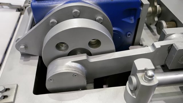 Crank drive gear wheel the part of industrial factory machine. Automated robotic production machinery.