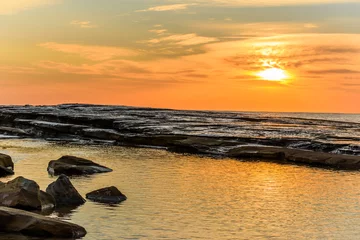 Fotobehang Rocky Sunrise Seascape © Merrillie