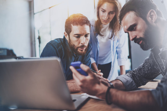 Concept of business team at working process.Coworkers meeting.Blurred background.Horizontal.