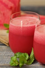 Delicious juicy watermelon and juice on the table