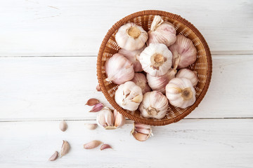Close up group of the  garlic on white wooden table board , top view or overhead shot with copy space