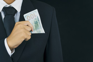 businessman holding dollar banknote