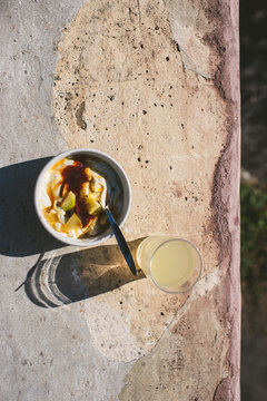 yogurt and fruit in sunlight