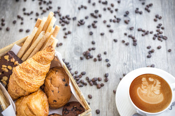 bread and rolls on old wood background (bread, bakery, basket)