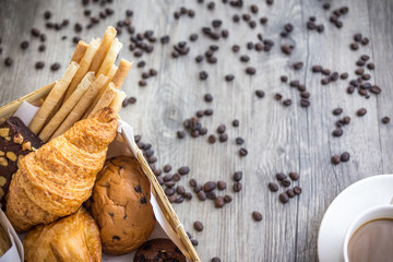 bread and rolls on old wood background (bread, bakery, basket)