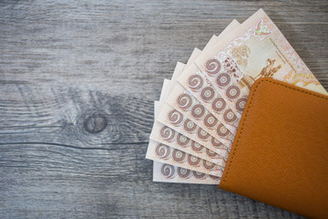 Thailand Passport and pile of Thai bath money (passport)