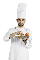 Italian chef preparing a dish on studio