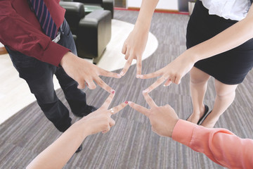 Business people making a friendship symbol