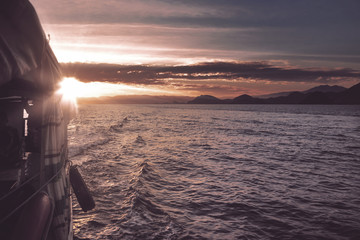 Fototapeta premium Beautiful sunset with tourist boat
