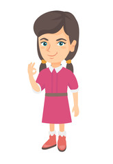 Caucasian little smiling girl showing an ok sign. Happy girl making an ok sign. Cheerful girl gesturing an ok sign. Vector sketch cartoon illustration isolated on white background.