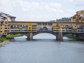 Obraz premium Iconic Vecchio Bridge in Florence over river Arno called Ponte Vecchio