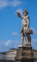 Fototapeta na wymiar Statue at Santa Trinita Bridge in Florence