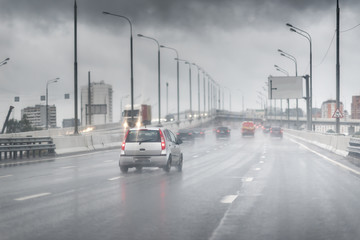 Drive car in rain on asphalt wet road