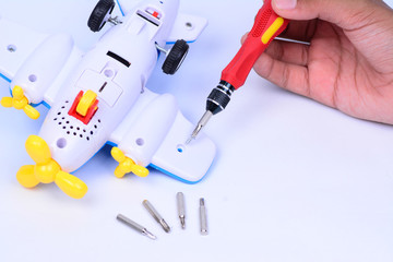Using magnetic screwdriver to dismantle a toy