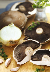 Fresh raw shiitake mushrooms on cooking board