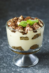 Homemade Italian dessert Tiramisu served in individual glasses