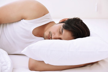 Fototapeta na wymiar Young asian man sleeping comfortably