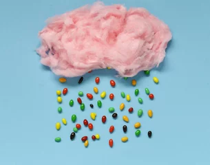  Sweet pink cotton candy on a colored background © Olga Kriger