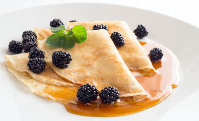 vegetarian dessert of pastry, fresh berries, and honey 