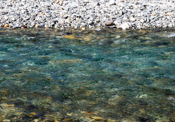 Beautiful alpine creek with clear blue water in Kamikochi valley - Nagano prefecture, Japan