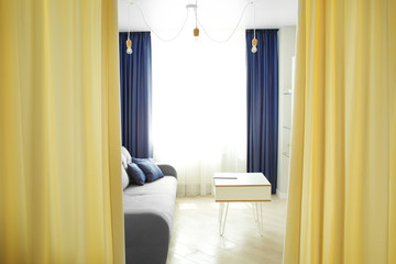 Interior of modern apartment with light living room