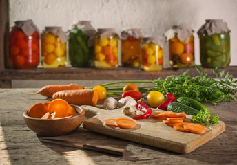 canned and fresh vegetables in jars