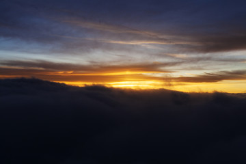 Fototapeta na wymiar Dramatic Sunrise over Clouds