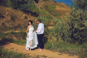 Young romantic couple during the wedding walk in nature. the bride and groom