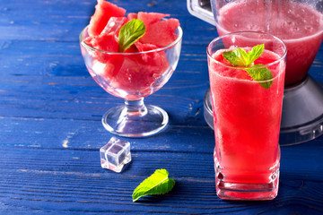 Watermelon smoothie with ice cube and mint